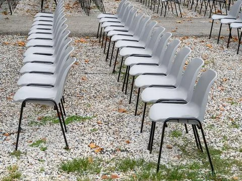 Group of empty plastic chair arranged in rows Stock Photos