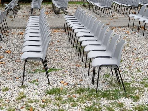 Group of empty plastic chair arranged in rows Stock Photos