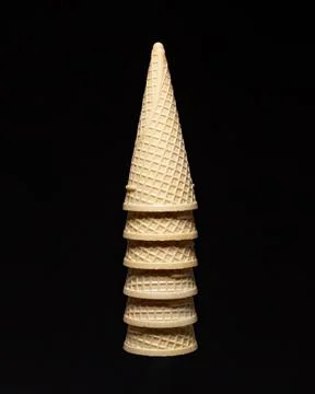 A group of empty waffles cones on black background Stock Photos