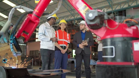 Group of engineer discuss in plant during robot operate Video stock 171280605