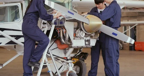 Group of engineer maintenance or develop in hangar airplane. 스톡 동영상 124730381