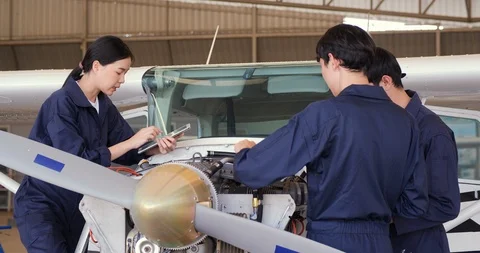 Group of engineer maintenance or develop in hangar airplane. Stock Footage 124776021