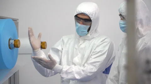 Group of engineer worker wearing ppe suite, face protective mask and glove di Stock Footage 141410541