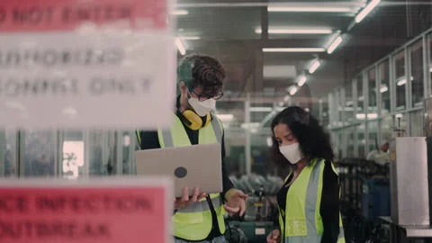 Group of engineering team wear face mask to operate in the industrial factory. Stock Footage 149321476