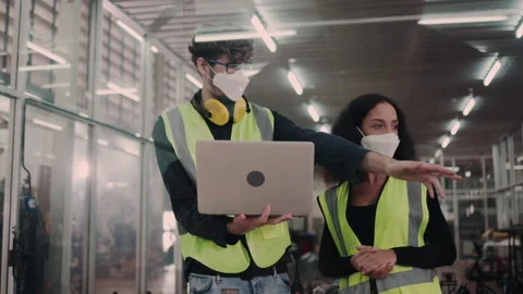 Group of engineering team wear face mask to operate in the industrial factory. Stock Footage 149321594