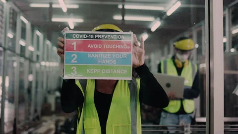 Group of engineering team wear face mask to operate in the industrial factory. Stock Footage 149321703