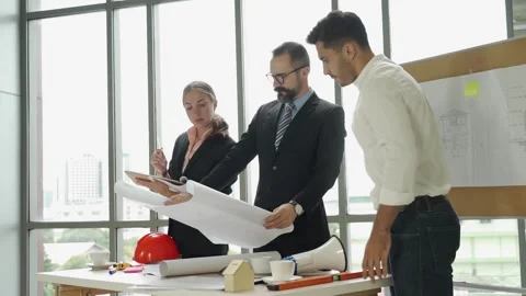 Group engineering with technical leader or manager working and meeting together Stock Footage 139248369