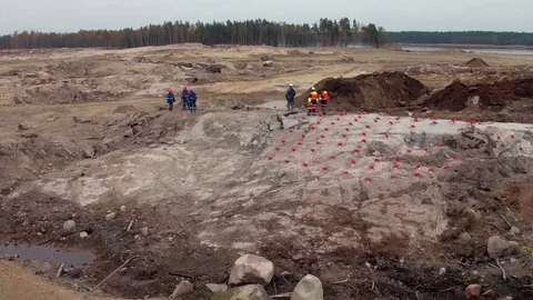 Group of engineers and workers preparing for explosive works on construction sit Stock Footage 69823851