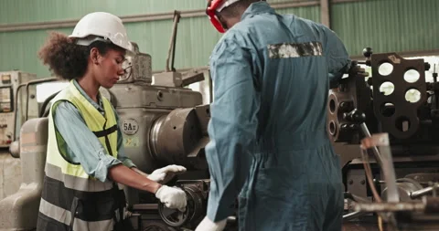 Group of engineers and workers standing happily  while working in a factory Stock Footage 255107605