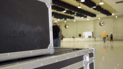 A group of engineers assembling multimedia equipment in an auditorium. Stock Footage 277468916