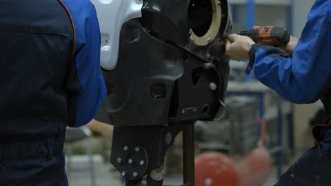 A group of engineers creates a modern robot or android. Check and repair broken Stock Footage 101373953