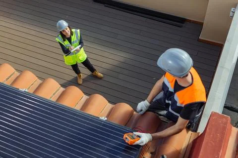 Group of Engineers doing maintenance inspection of photovoltaic panels Stock Photos