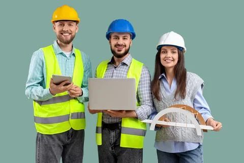 Group of engineers with gadgets and bridge model on green background Stock Photos