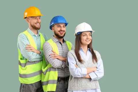 Group of engineers on green background Stock Photos