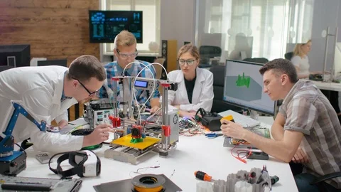 Group of engineers using 3d printer Stock Footage 97583032