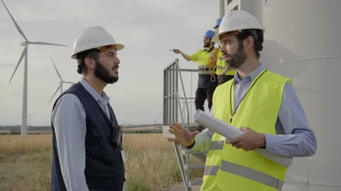 Group of engineers in Wind power station. Renewable and clean energy concept Stock Footage 219567503