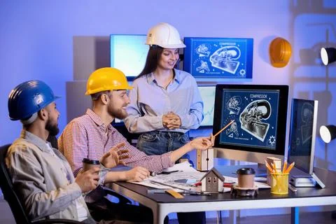 Group of engineers working with computer in office at night 스톡 사진