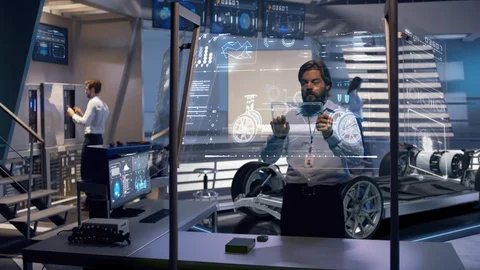 Group of engineers working on the design of physical electric car concept Stock Footage 119669740