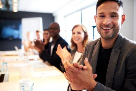 Group of executives facing camera and clapping Stock Photos