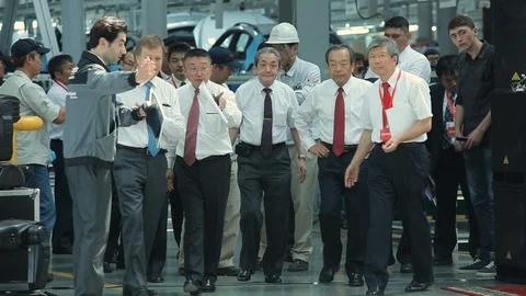 A group of executives visit the car factory. Stock Footage 126703542