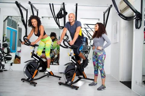 Group at an exercise class using spinning bikes Stock Photos