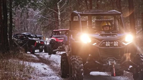 Group of extreme buggy UTV vehicle ride thgough forest Stock Footage 177343908