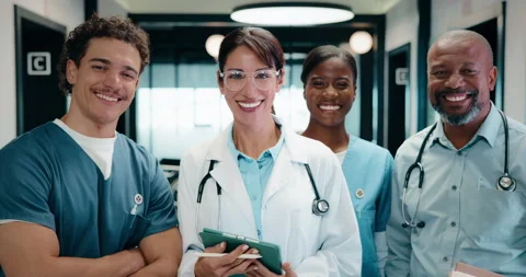 Group, face and doctors with tablet in clinic, healthcare and confident with Stock Footage 335452522