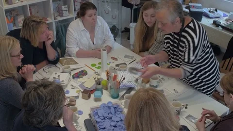 Group of female artists discuss their next project togeather Stock Footage 76894271