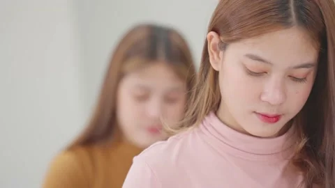 A group of female students sitting in a class and taking exams in a classroom Stock-Footage 147956955