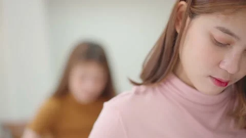 A group of female students sitting in a class and taking exams in a classroom Stock Footage 147957049