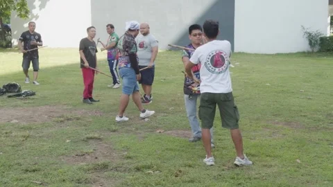 A group of Filipinos practicing their 'Arnis' martial arts stick fighting skills Stock Footage 287899951
