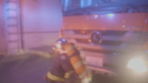 A group of firefighters are performing tasks. 4K Stock Footage 126021726