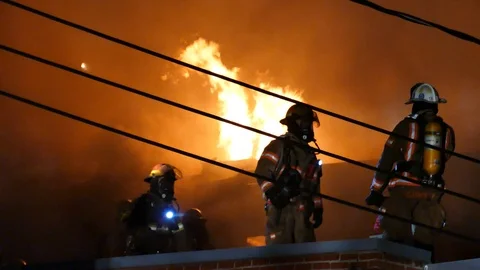 Group of firefighters with flames Stock Footage 115934358