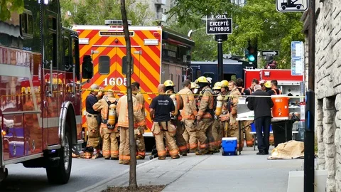 Group of firefighters in the street Stock Footage 116713631
