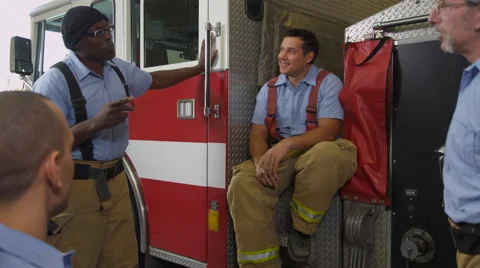 Group of firefighters talking Stock-Footage 61676302
