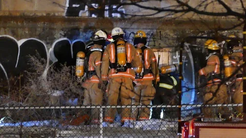 Group of firefighters working during fire Stock Footage 105339886