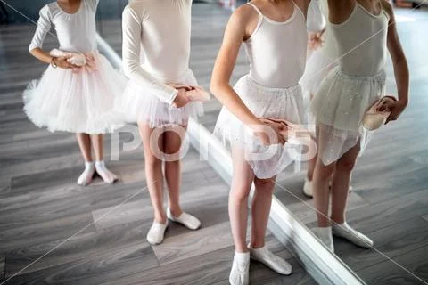Group of fit happy children exercising ballet in studio together Stock Photos