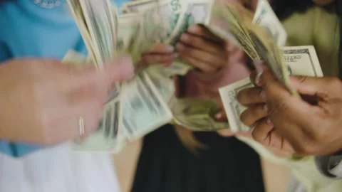 Group of five multiracial female students counting money together in a modern Stock Footage 300734444