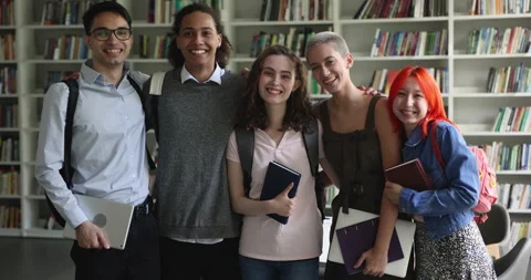 Group of five multiracial students look at camera pose indoors Stock Footage 239224617