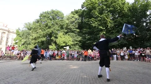 A group of flag throwers making a performance on the square. Видео 157550226