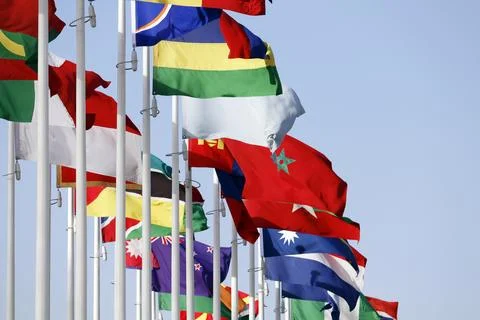 Group of flags of many different nations against blue sky during expo 2020 Stock Photos