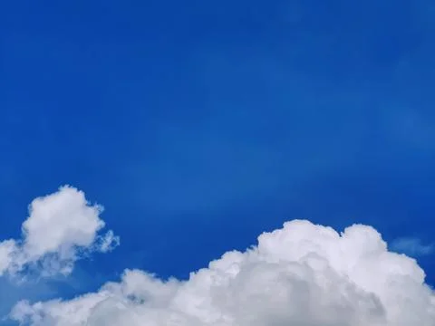 Group of Fluffy Clouds on Blue Sky Stock Photos