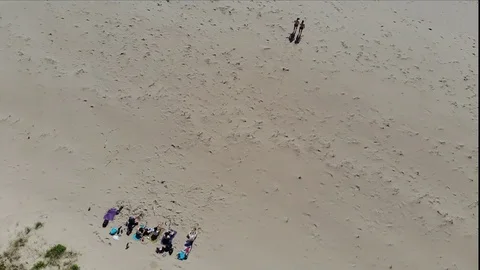 Group flyover on beach RAW Stock Footage 122951456