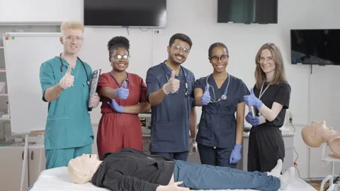 Group of foreign students in first aid training give a thumbs up Video stock 281364964