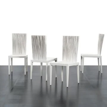 Group of four designer chairs Stock Photos