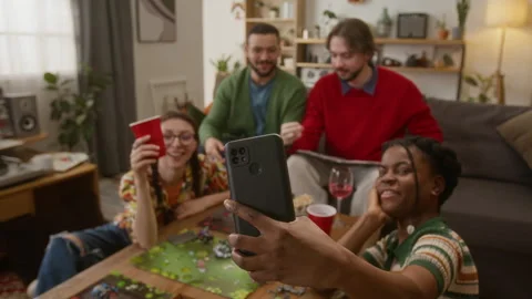 Group of Four Diverse Friends Taking Selfie While Playing Tabletop RPG Game Stock Footage 335863099