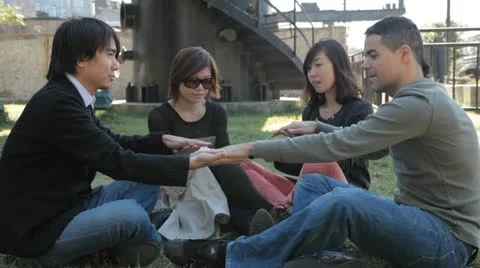 Group of Four Friends Having Fun Playing Hand-Slapping Game Video stock 22223421