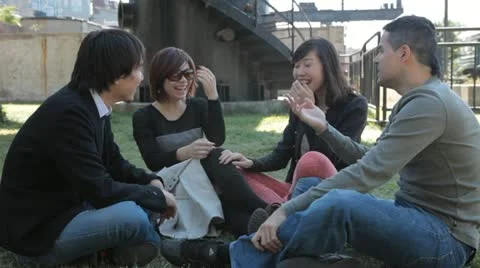 Group of Four Friends Having Fun Playing Hand-Slapping Game Video stock 22223596