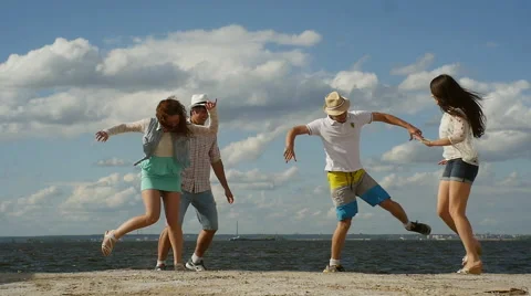 Group of Four Friends Having Fun on the Beach.  Funny Dancе Stock Footage 60843473