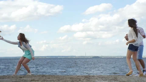 Group of four Friends Having Fun on the Beach. Dancе Stock Footage 60843484